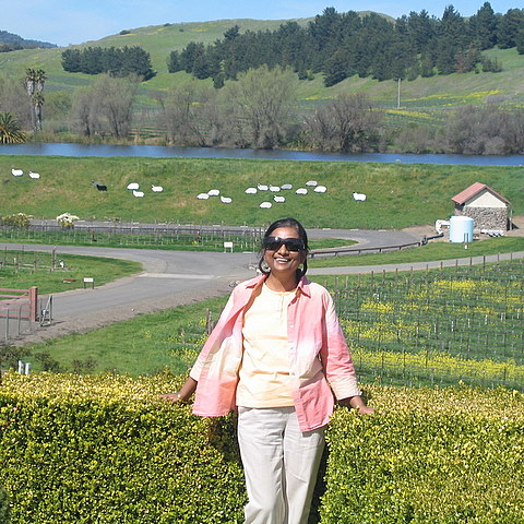 picture of the author on a beautiful summer day in the gardens of a wine estate